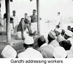 Mahatma Gandhi addressing workers