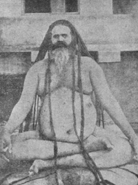 Picture depicts a Naga Sadhu. Naga Cult, is a cult which originated from the Tantra Cult. A Naga Sadhu remains nude through out the year.